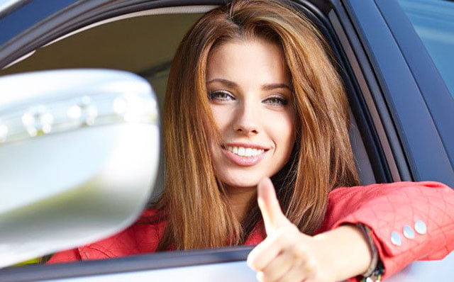 A woman in a car in Ohio with her driver's license back!